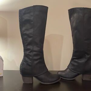 Black knee high boots. Side zipper. Worn once.